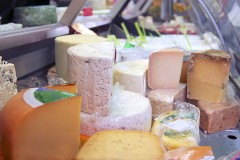 a cheese display at a dairy products store
